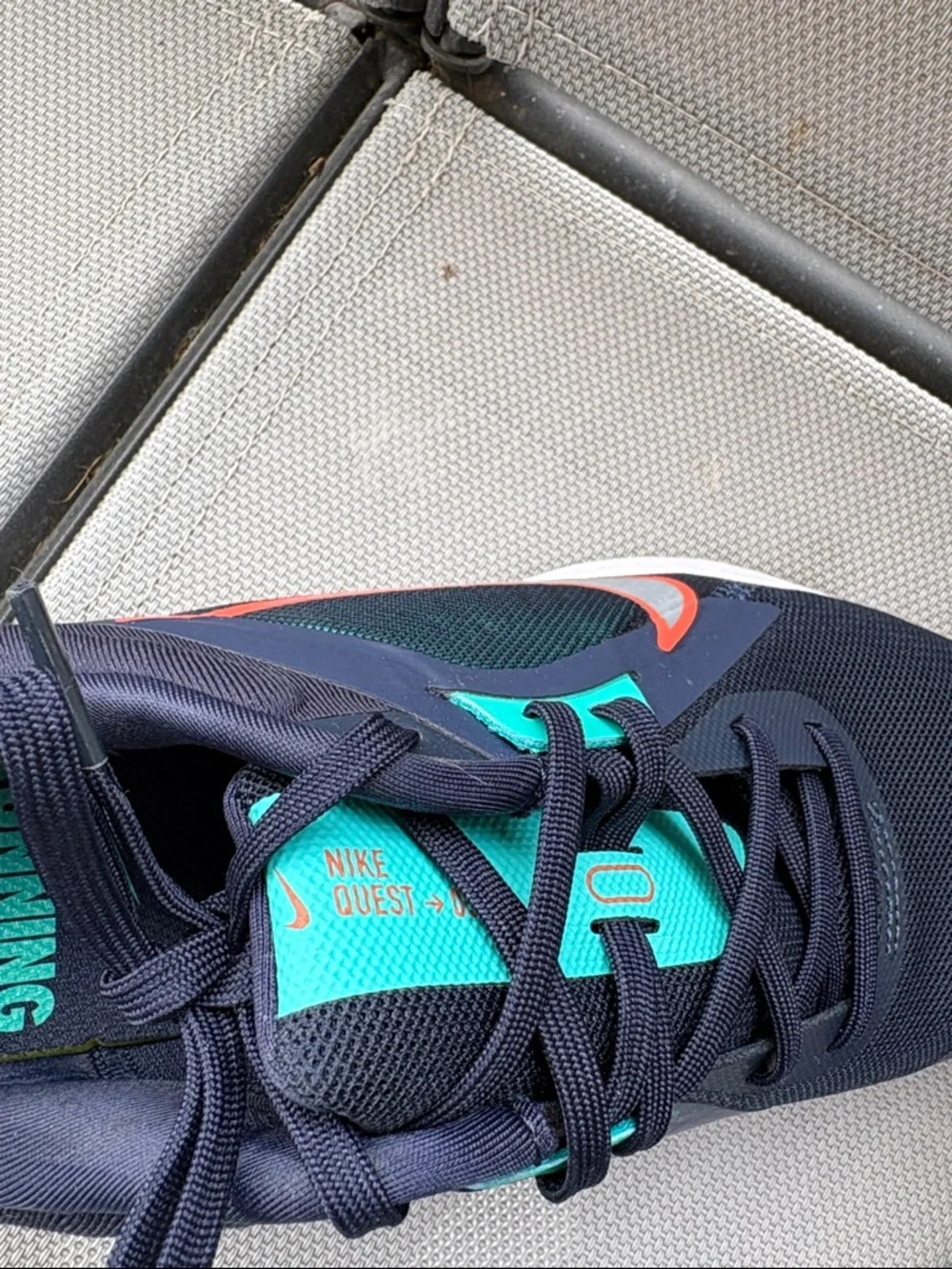 Nike Stylish Navy and Teal Women’s Running Sneakers with Orange Swoosh